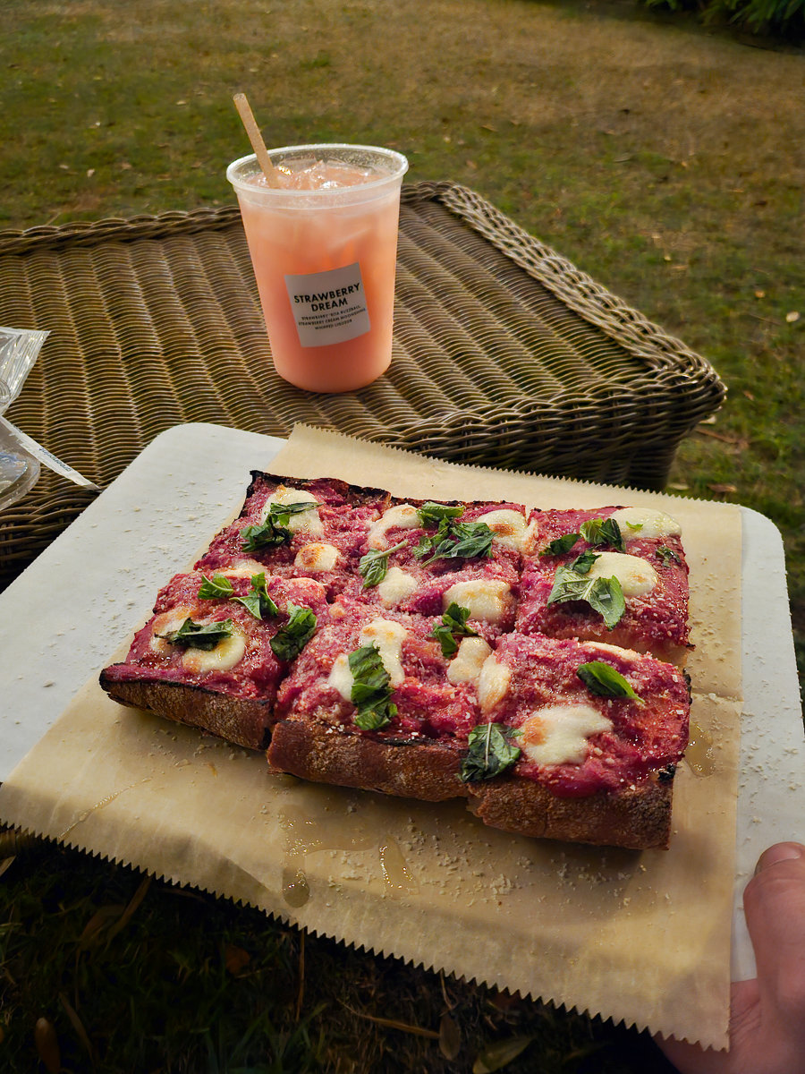 pizza flatbread with drink on a table